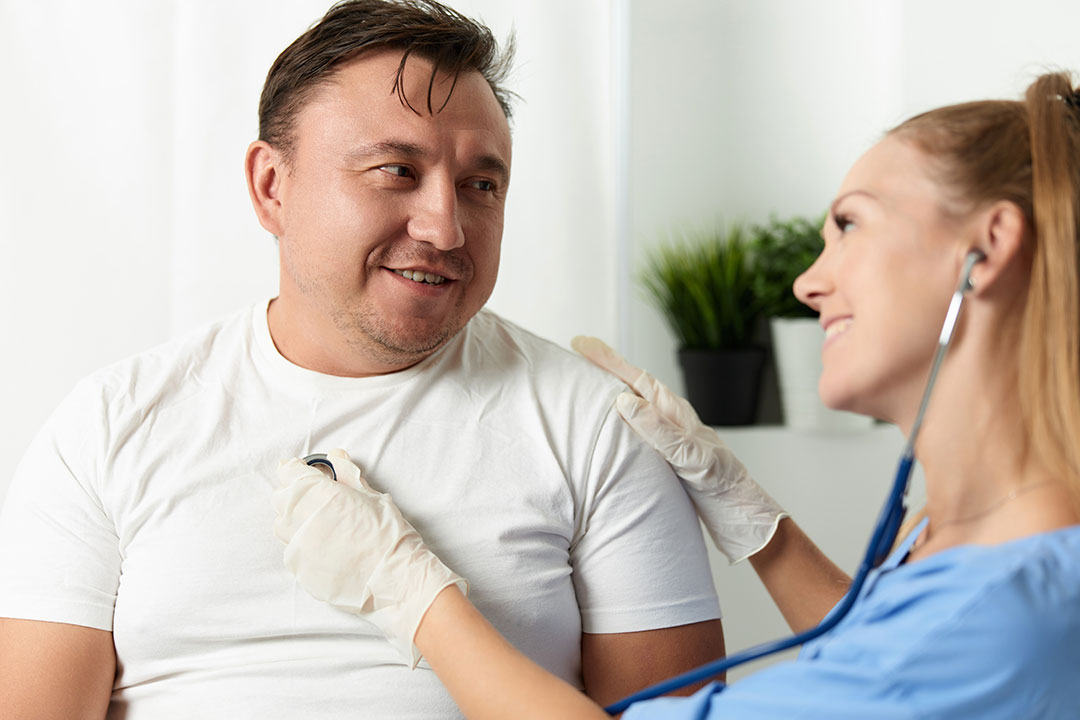 Nurse checking on a patient