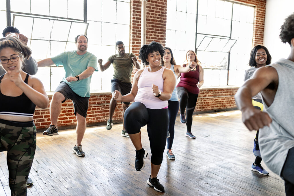 group of diverse people exercising in a class